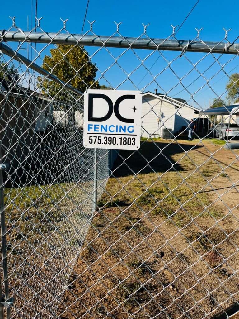 6 ft residential chain link fence in Dimmitt, TX with DC Fencing logo
